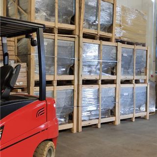 Crated equipment stacked in the warehouse, ready for dispatch