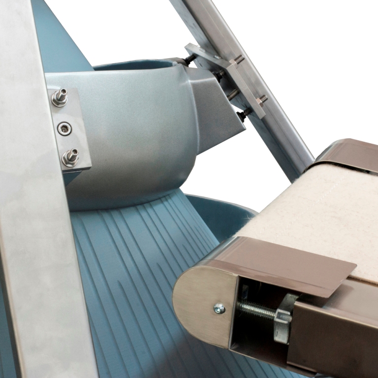 Dough line detail — stainless hopper and conveyor belt